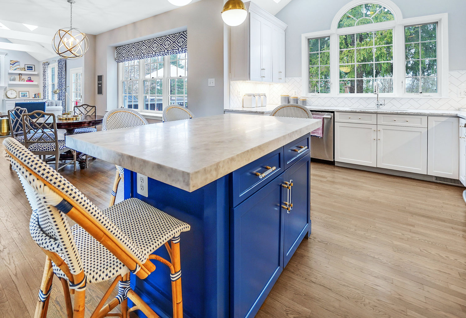 kitchen design with marble countertops, blue island, acrylic gold handles, custom window treatments, custom chairs