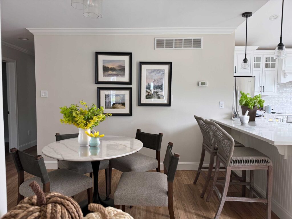 Breakfast area and kitchen renovation in Downingtown. New furnishings, painted cabinets, new countertops, original art , light and bright design