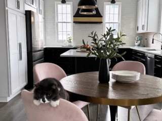 Kitchen remodel featuring two tone cabinets,, stove flanked by windows, island, small kitchen, cabinet storage