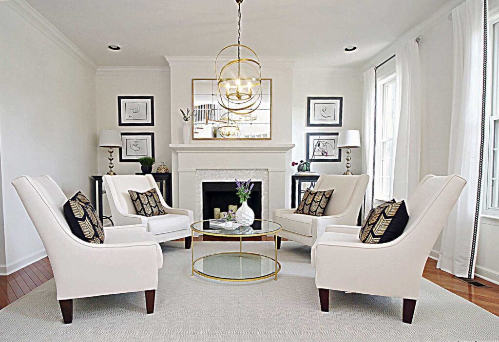 Interior designer transforms this living room in Downingtown with White Dove paint color, shades of white and gold and black accents