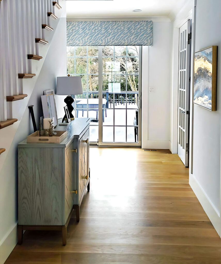 Entryway in Devon remodel featuring custom window treatments