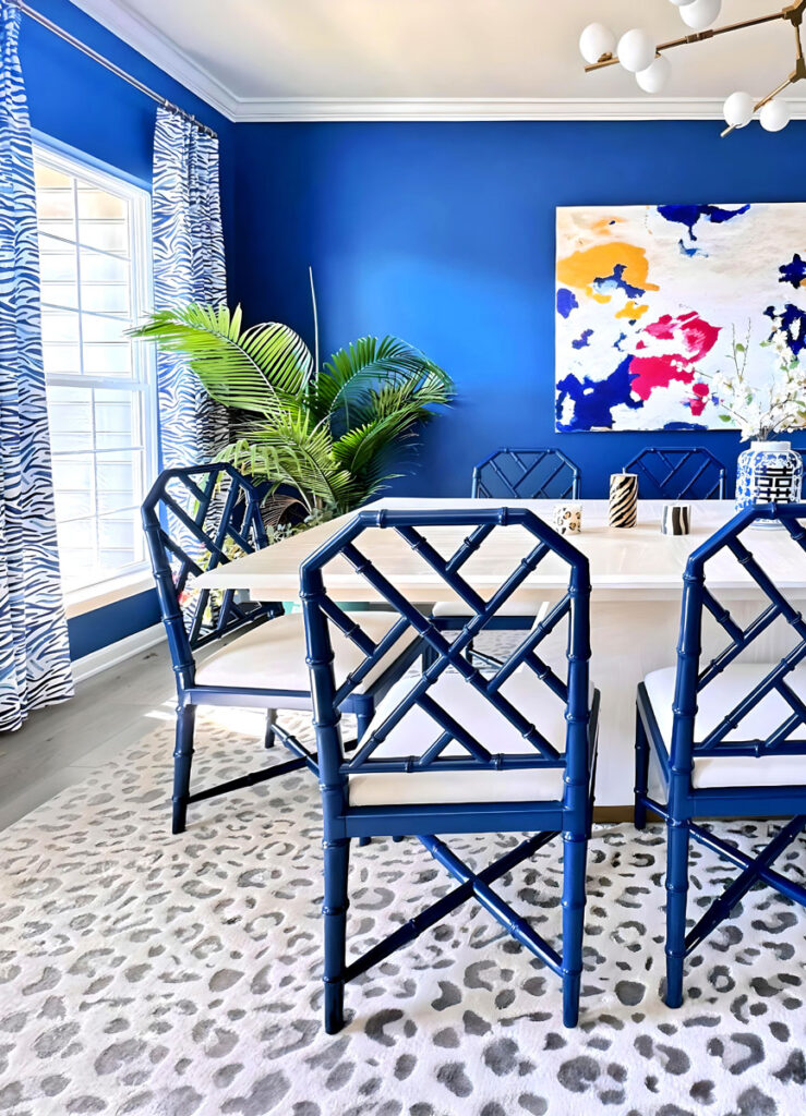 dining room design in Chester County, Philadelphia with bold blue walls and animal print window treatments