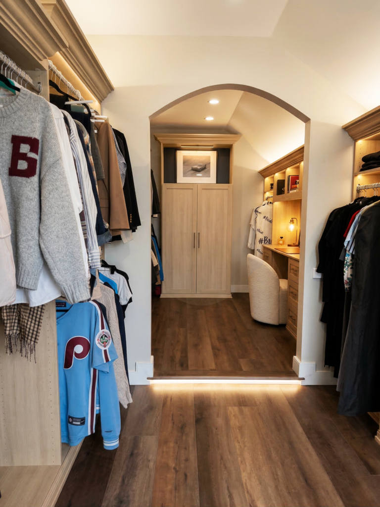 Custom walk-in closet design with built-in cabinetry and dressing area in West Chester PA