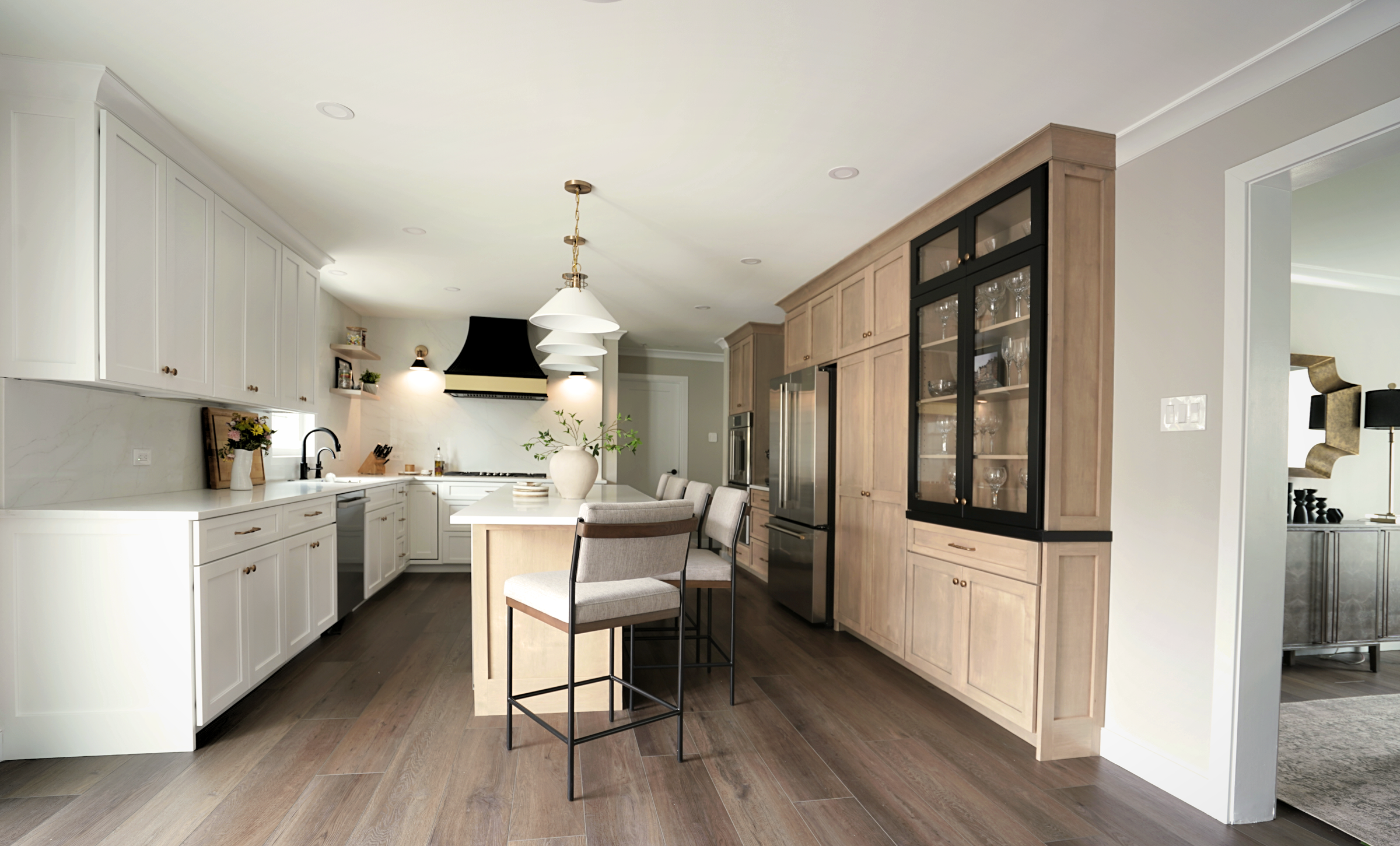 open concept kitchen remodel in west chester pa featuring two tone cabinets, white oak and black accents