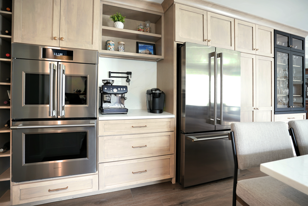 Custom kitchen storage wall with integrated appliances and coffee station.