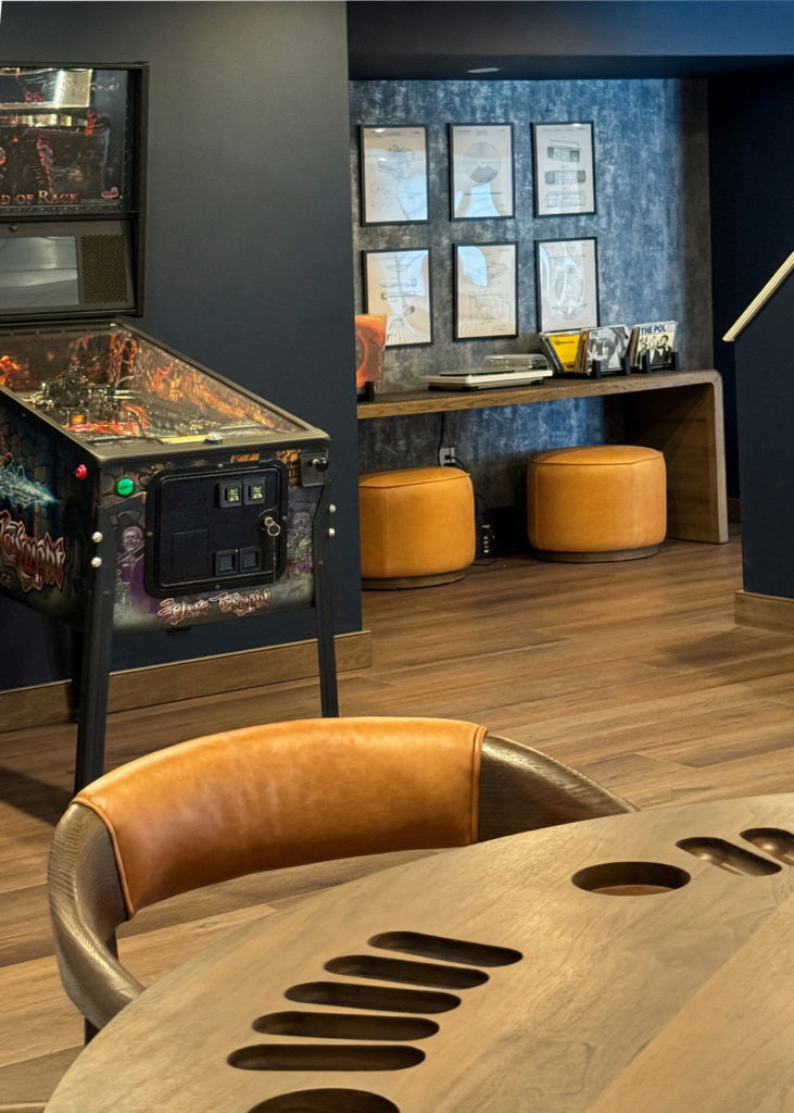 Basement lounge area with record collection and retro entertainment theme